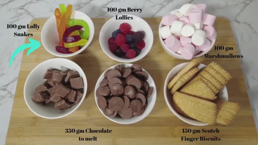 Ingredients for Rocky Road — chocolate, lolly snakes, berry lollies, marshmallows and Scotch Finger biscuits