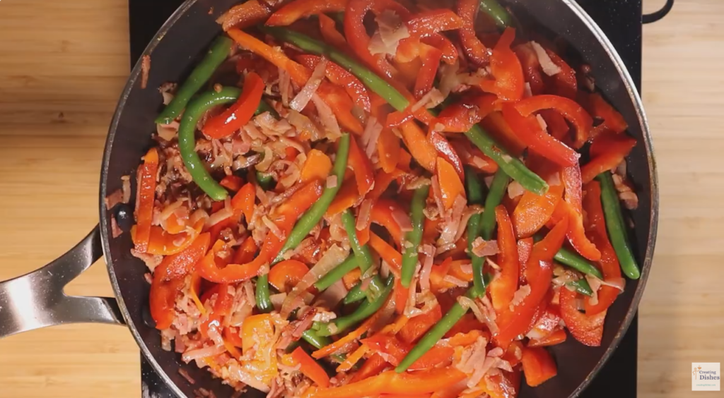 Sauté the aromatics and vegetables for Hokkien Noodles.